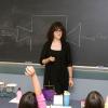 Elementary students eagerly participating in math activities.